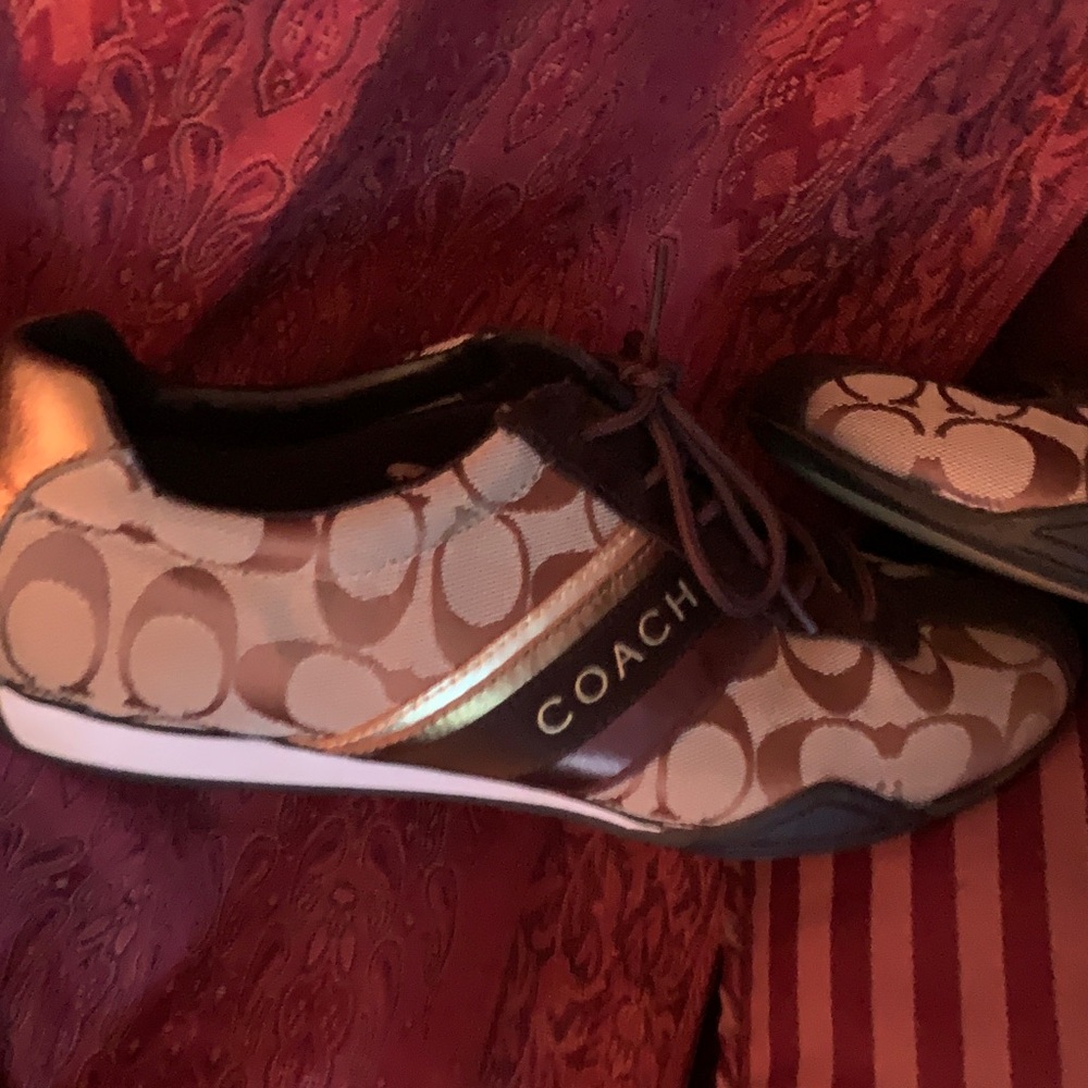 Coach Tan and Gold Logo Sneakers
Jayme Coach. Excellent condition